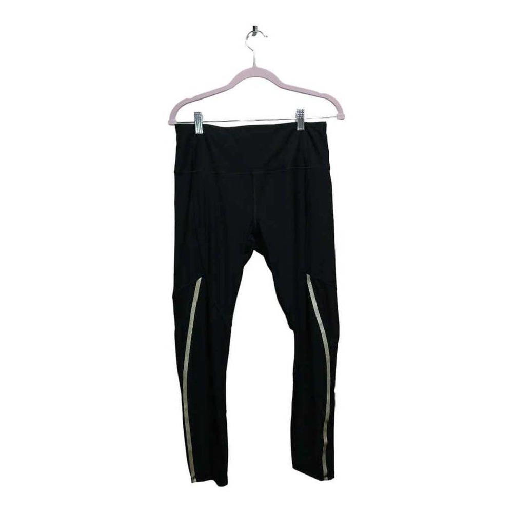 Black Workout leggings by RBX w/reflective stripes Sz L Poly 92%  Spandex 8%‎